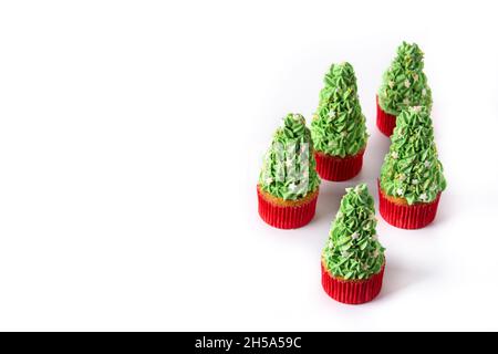 Christmas tree cupcakes isolated on white background Stock Photo