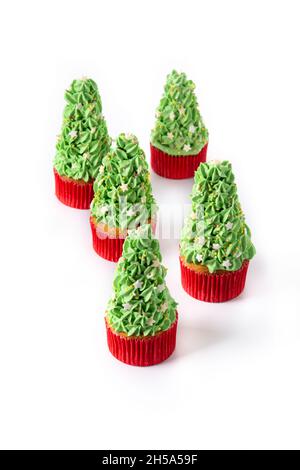 Christmas tree cupcakes isolated on white background Stock Photo