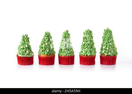 Christmas tree cupcakes isolated on white background Stock Photo