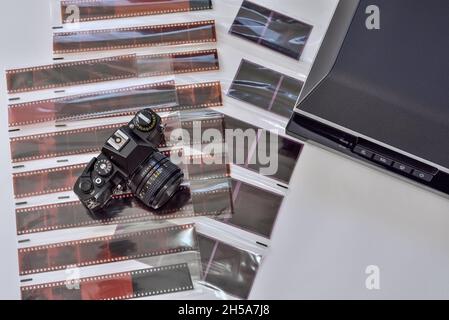 Film photography and scanning photo negatives using a scanner. Film camera with films negative various formats and scanner for scanning and digitizing Stock Photo