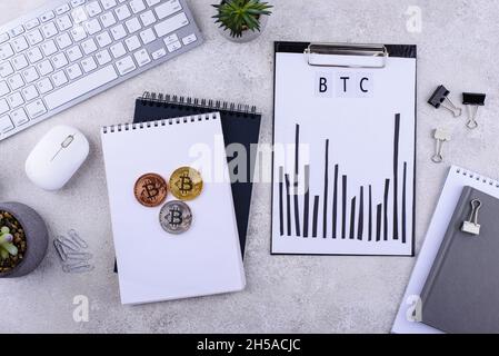 Bitcoin shedule on desk. Cryptocurrency concept Stock Photo