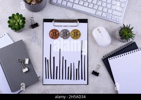 Bitcoin shedule on desk. Cryptocurrency concept Stock Photo