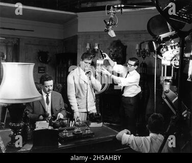 JOHN GREGSON as Colonel Roberts and ROGER MOORE as Simon Templar on set candid at Associated British Elstree Studios during filming of THE SAINT episode ESCAPE ROUTE aired December 30th 1966 Season 5 Episode 13 director ROGER MOORE writer Leslie Charteris screenplay Michael Winder music Edwin Astley producer Robert S. Baker Bamore / Incorporated Television Company (ITC) Stock Photo