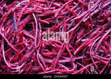 Grated beets, close-up, full screen, backgrounds and textured. Stock Photo