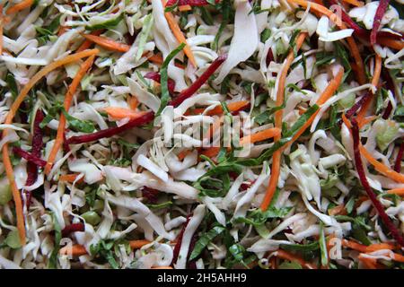 Vegetables and vegetables: carrots, cabbage, beets and cabbage, grated, close-up, full screen. View from above. Stock Photo