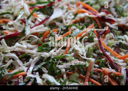Vegetables and vegetables: carrots, cabbage, beets and cabbage, grated, close-up, full screen. Selective focus. View from above. Stock Photo