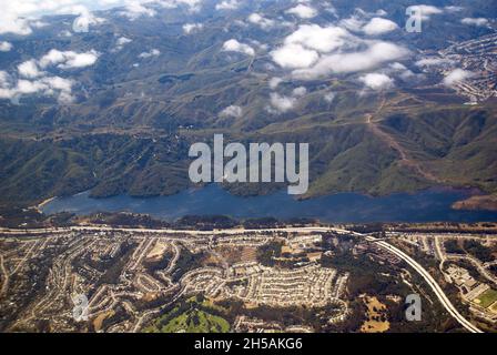 Flying over the San Francisco Peninsula: the San Andreas Lakes, Interstate Highway 280 and the western suburbs of Millbrae.