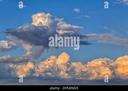 Cumulonimbus clouds in the sky at sunset. Stock Photo