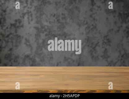 Empty table with free space and blurred grey wall. Stock Photo