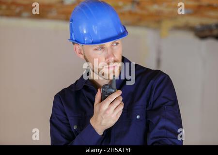 smart engineer using a walkie talkie Stock Photo
