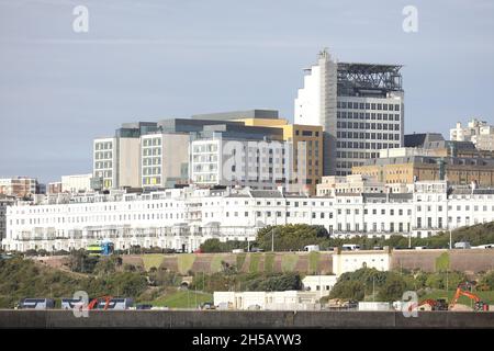 General view Chichester Terrace and the newly built Royal Sussex County Hospital complete and Helipad. This terrace of houses was designed by Amon Wilds and Charles Augustin Busby for the developer Thomas Read Kemp. They were part of the Kemp Town Estate. The builder Thomas Cubitt built numbers 1-3 and completed the terrace in 1855. Picture James Boardman Stock Photo