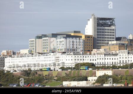 General view Chichester Terrace and the newly built Royal Sussex County Hospital complete and Helipad. This terrace of houses was designed by Amon Wilds and Charles Augustin Busby for the developer Thomas Read Kemp. They were part of the Kemp Town Estate. The builder Thomas Cubitt built numbers 1-3 and completed the terrace in 1855. Picture James Boardman Stock Photo