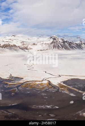 Aerial view of a snowy landscape along the south coast of Snaefellsnes in wintertime, Vesturland, Iceland Stock Photo