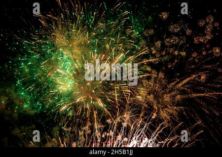 Colourful fireworks exploding against a night sky Stock Photo