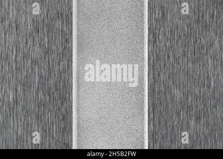 Background made from a macro photo of a rough and smooth metal surface. Stock Photo