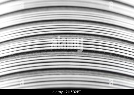 Background made from a macro photo of a flexible corrugated aluminum tube surface. Stock Photo
