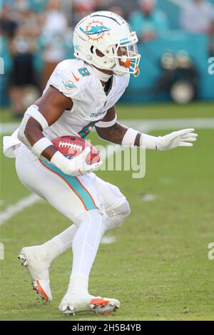 Miami Dolphins free safety Jevon Holland (8) intercepts a pass in the end  zone intended for Houston Texans wide receiver Brandin Cooks (13) during  the first half of an NFL football game