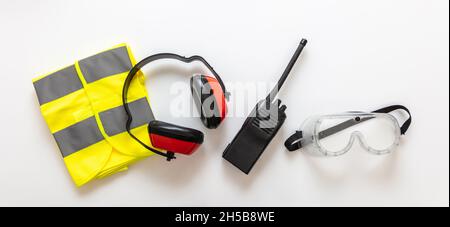 Safety health worker gear. Work wear protection isolated on white background, Personal protective and communication equipment, top view Stock Photo