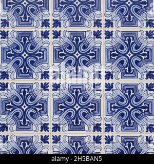 Fragment of building wall with colorful ceramic wall tiles. Azulejos close up. Abstract decorative background. Traditional ornate Portuguese art. Stock Photo