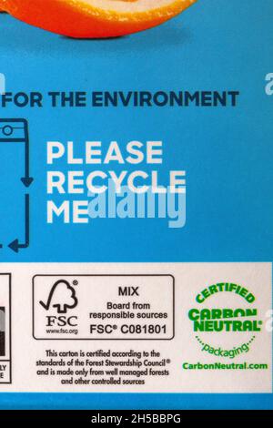 Please recycle me certified carbon neutral packaging logo symbol detail information on carton of Tropicana smooth orange with no bits juice drink Stock Photo