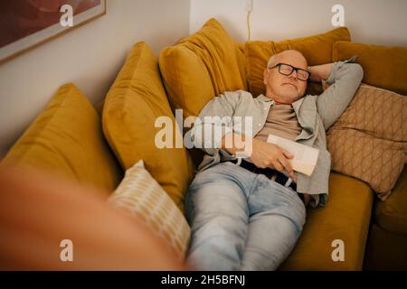senior man sleeping on sofa at home Stock Photo - Alamy