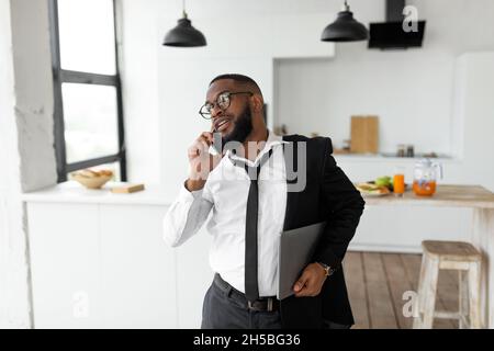 African American man talking on mobile phone in a hurry Stock Photo