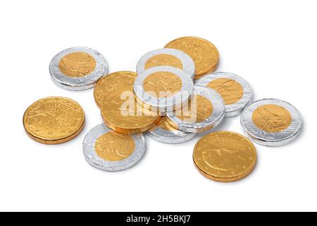 Heap of golden and silver chocolate coins for the celebration of Sint Nicolaas close up on white background Stock Photo
