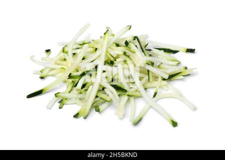 Heap of fresh cut zucchini noodles close up isolated on white background Stock Photo