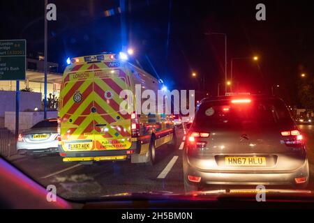 Seen from the passenger seat of a car, an Emergency Services Incident Response vehicle on blue lights squeezes through the traffic on the A4 road in West London, on 7th November 2021, in London, England. Stock Photo