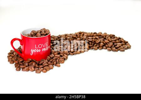 coffee grains in cup and table top on white table Stock Photo