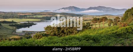 Early morning view across Loch Ascog reservoir towards the Isle of Arran from Canada Hill  near Rothesay on the Isle of Bute, Scotland, UK. Stock Photo