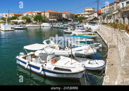 Fishing boats in the harbour of Agios Nikolaos near Stoupa on the Mani peninsula of the Southern Peloponnese of Greece Stock Photo