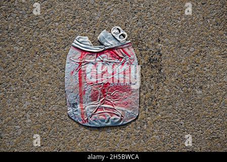 Crushed and faded coca-cola can. Stock Photo