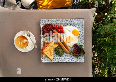 Served english breakfast with cappuccino coffee Stock Photo