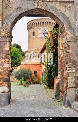 Ostia Antica,Rome,Lazio,Italy-Porta del borgo-Next to the castle of Julius II stands the Renaissance village of Ostia Antica, of medieval origin. Stock Photo