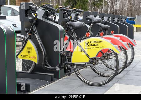 Bucharest, Romania, 16 March 2019: Public bike sharing bicycles from iVelo and Raiffeisen Bank in a docking station, available for for rental for citi Stock Photo