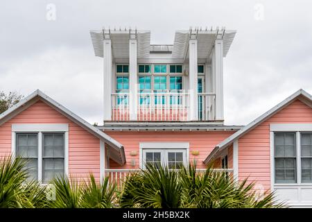 Wooden house tower new urbanism pastel pink architecture design by beach ocean in Seaside, Florida view on cloudy day Stock Photo