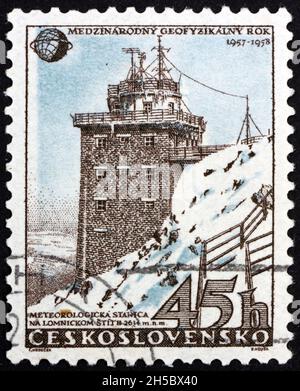 CZECHOSLOVAKIA - CIRCA 1957: a stamp printed in Czechoslovakia shows meteorological station in High Tatra, circa 1957 Stock Photo