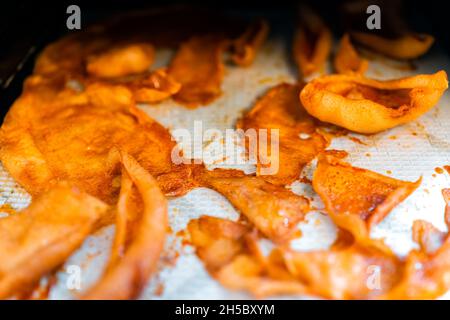Dehydrator plastic tray sheets with dehydrated vegetables young coconut slices for jerkey or bacon or mushroom slices raw vegan food Stock Photo