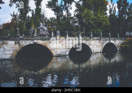 Bridge at Agrykola street with King Jan III Sobieski monument in Royal Baths Park in Warsaw, Poland Stock Photo