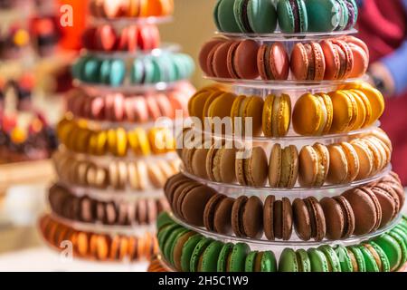 Colorful macaroons on a tower tray in a pastry shop. Stock Photo