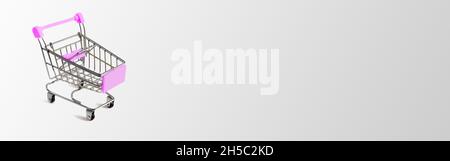 Shopping cart on gray background with copy space. Business concept of shopping for goods in supermarkets Stock Photo
