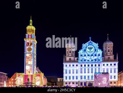 AUGSBURG, GERMANY - OCTOBER 24: Illuminated historic buildings (town hall and perlach tower) at the festival of lights in Augsburg, Germany on October Stock Photo