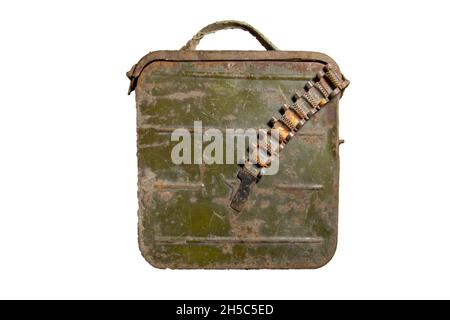 Old metal ammo box with empty machine gun belt isolated on white background. Stock Photo