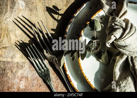 Rustic table setting with Easter eggs for Easter dinner Stock Photo