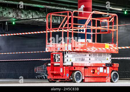 Construction self-propelled scissor lift for construction and installation works. Saint-Petersburg. Russia. October 20 2021 Stock Photo