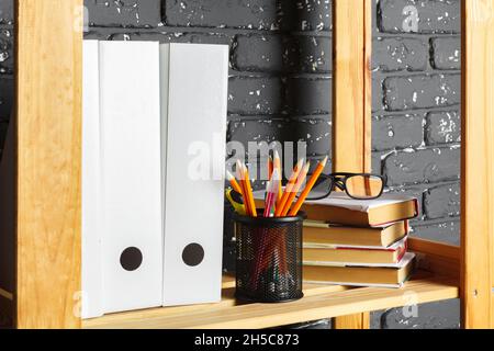 File folders, standing on the shelves at office Stock Photo