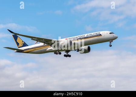 Singapore Airlines Airbus A350 airliner jet plane 9V-SMG on approach to land at London Heathrow Airport, UK. Long haul international air travel Stock Photo