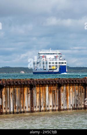 isle of wight ferry service leaving the port of yarmouth on the coastline of the isle of wight, wightlink isle of wight ferry leaving for lymington. Stock Photo
