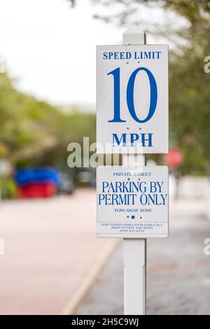 Seaside, USA - January 10, 2021: Closeup of small town residential street road sign for speed limit 10 miles hour by beach in Florida panhandle gulf o Stock Photo